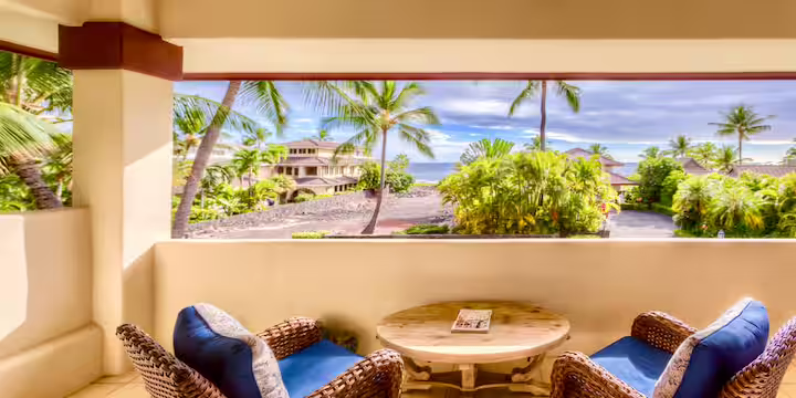 Covered lanai with comfortable outdoor seating, ocean views and sunset views